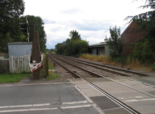 Photo 6x4 Train approaching Brooksby The half barriers had just dropped a c2010