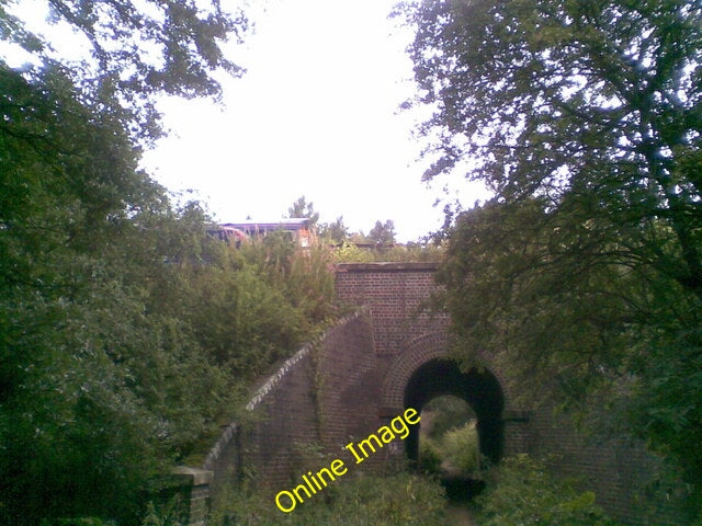 Photo 6x4 Harlestone Firs Church Brampton A railway bridge carrying the N c2010