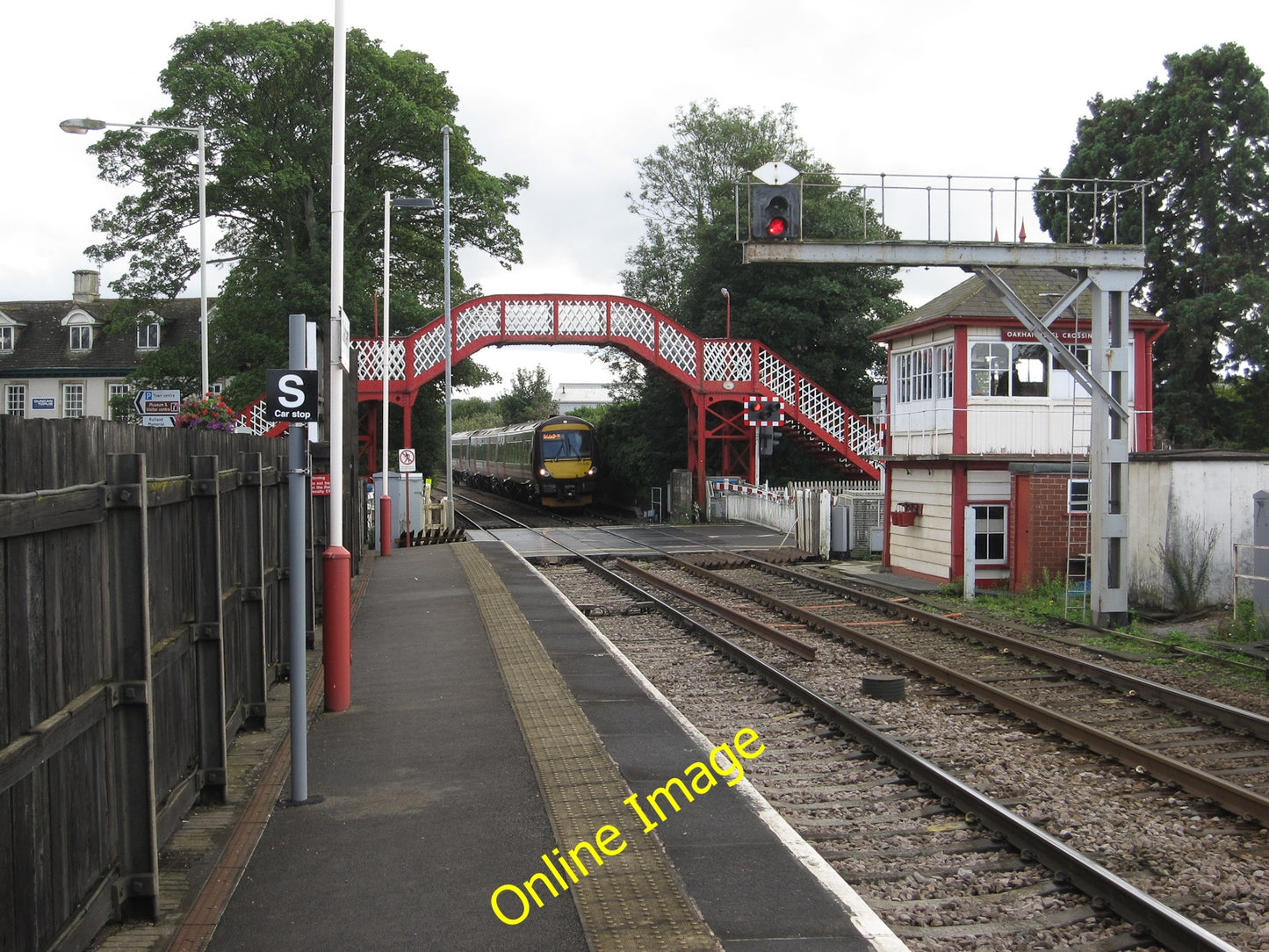 Photo 12x8 Oakham railway station level crossing Oakham\/SK8509 Train appr c2010