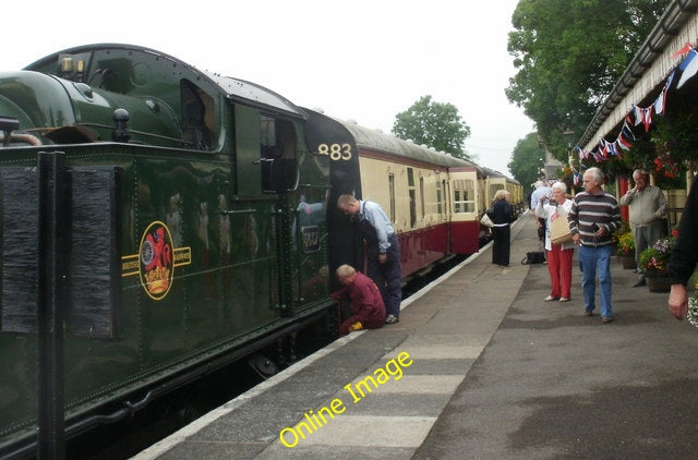 Photo 6x4 Station scene at Cranmore Cranmore\/ST6643 The man in the overa c2010