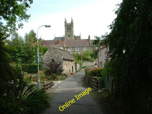 Photo 6x4 Houses and church, Collessie Viewed from beneath the railway br c2010